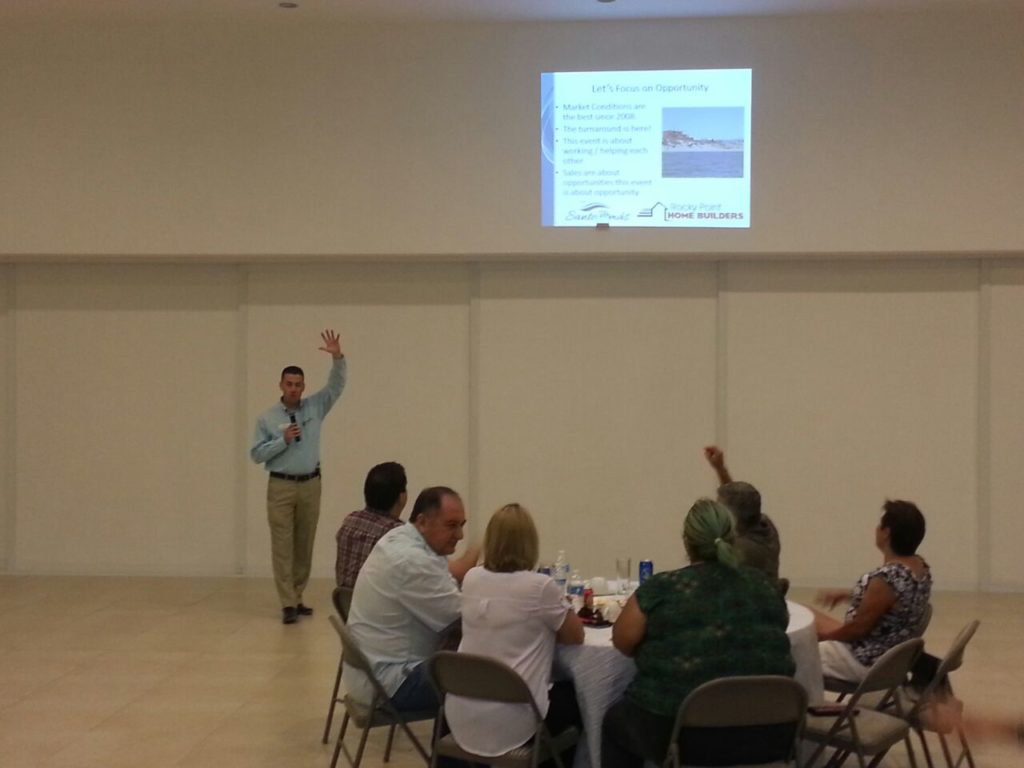 Joseph Sanchez, President of Rocky Point Home Builders, talks opportunity with a room full of approximately 40 Puerto Peñasco real estate agents during a special dinner presentation for them. 